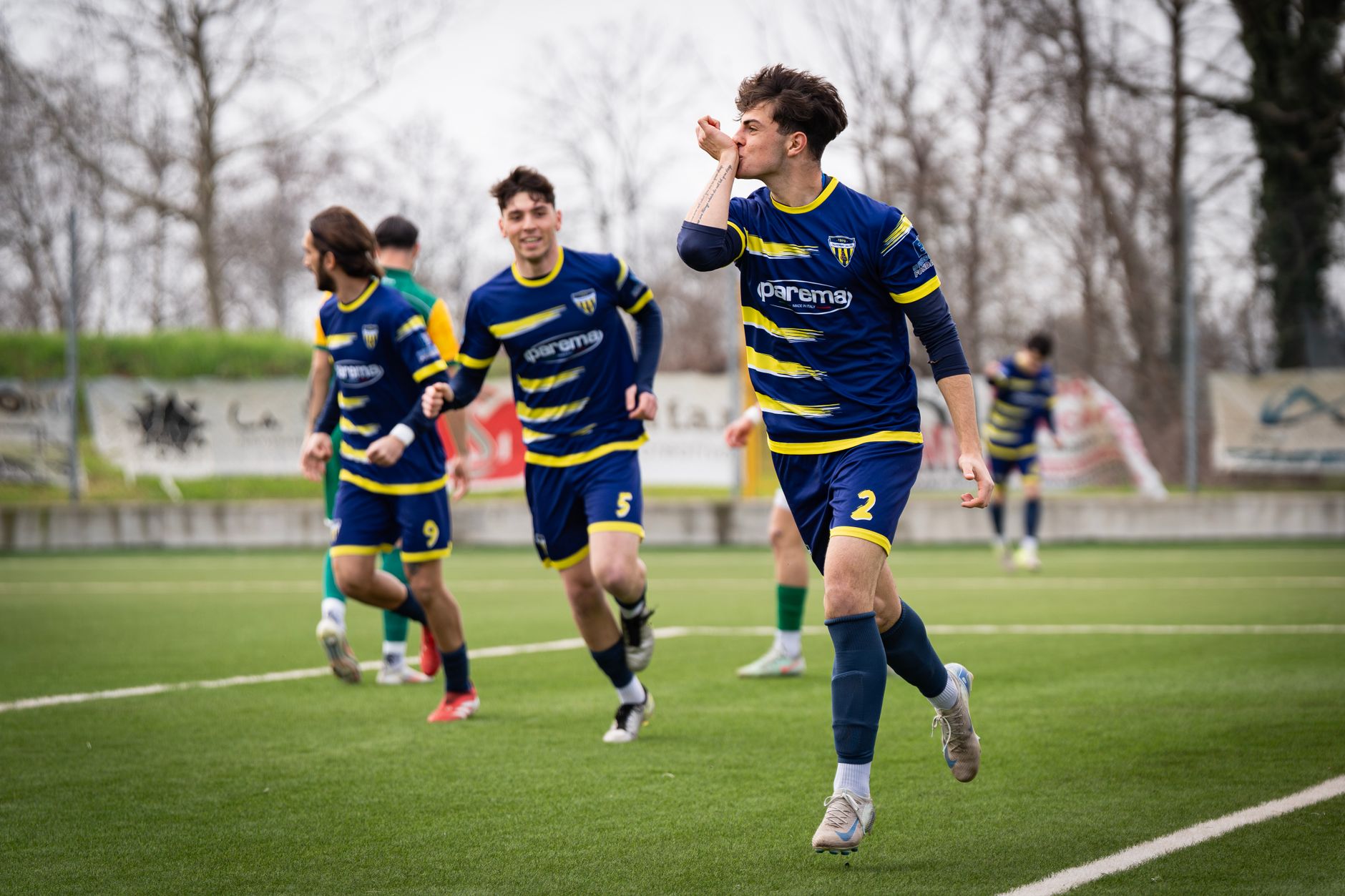 youth soccer team celebrating on the field